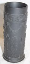 A Wedgwood black basalt cylindrical vase with raised classical decoration,