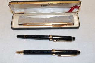 A marbled pair of collector's fountain pens/pencils and a propelling pencil by Cross,