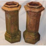 A pair of 19th century terracotta hexagonal chimney pots,