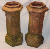 A pair of 19th century terracotta hexagonal chimney pots,