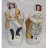 A pair of 19th century Staffordshire pottery flat-back figures of a fisherman and fisher wife with