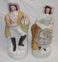 A pair of 19th century Staffordshire pottery flat-back figures of a fisherman and fisher wife with