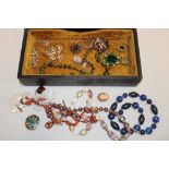 A selection of various costume jewellery including dress brooches, necklaces etc.