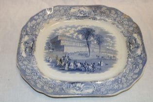 A 19th century Staffordshire pottery meat platter depicting a blue and white Crystal Palace scene
