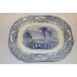 A 19th century Staffordshire pottery meat platter depicting a blue and white Crystal Palace scene