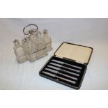 A good quality cut-glass and silver-plated six-section cruet with matching bottles and a cased set
