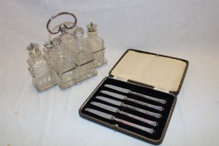 A good quality cut-glass and silver-plated six-section cruet with matching bottles and a cased set