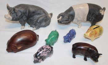 Two various pottery pig figures, 9" long,