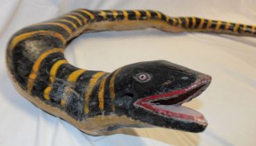 An unusual African painted wood one-piece figure of a snake 26" wide