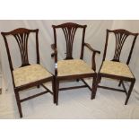 A set of four single and two carver Victorian beech Chippendale-style dining chairs with pierced