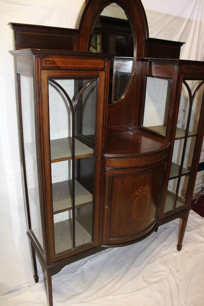 A late Victorian inlaid mahogany display cabinet with central bevelled oval mirror and cupboard - Image 2 of 2