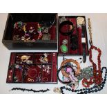 A Morocco leather jewellery box containing a quantity of various costume jewellery including