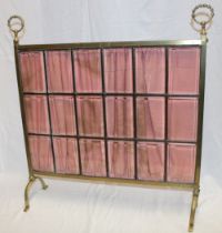 An Edwardian brass rectangular fire screen with leaded bevelled glazed panels