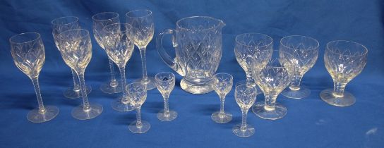 A Stuart crystal part drinks set comprising a set of six wine goblets with tapered stems,