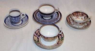 Two early 19th century Derby china tea cups and saucers with painted decoration together with two
