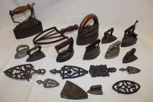 A selection of various old irons including Victorian box iron, oval iron by J. & J.
