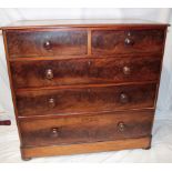 A Victorian mahogany chest of two short and three long drawers with turned handles on plinth base,