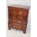 A good quality reproduction mahogany chest of three short drawers above one additional base drawer