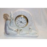 A good quality Lladro china mantel clock with figure and swan decoration after Vincente Martinez,