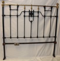 A Victorian brass mounted cast iron double bed with side rails and fittings,