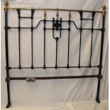 A Victorian brass mounted cast iron double bed with side rails and fittings,