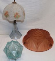A 1930's/40's amber tinted glass inverted dome ceiling lightshade with angular decoration;