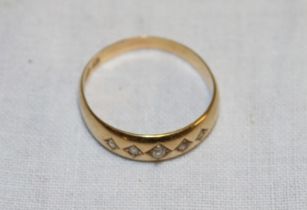 An 18ct gold gypsy-style dress ring set five diamonds (2.