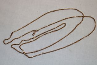 A 9ct gold long guard necklace (28.