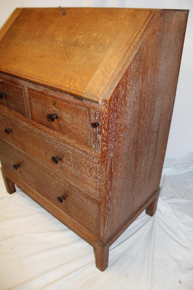 A 1930's/40's limed oak bureau by Heal & Son Limited London with pigeon holes and drawers enclosed - Image 3 of 4