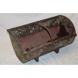 A 19th century Cornish cast-iron animal feeding trough with central bar division,