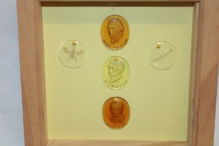 Five various glass seal-type plaques including Bismarck, Blucher etc.
