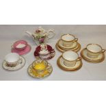 A selection of various Royal Worcester tea ware including four decorative tea cups and saucers,