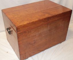 An old polished elm rectangular trunk with hinged lid and iron ring handles,