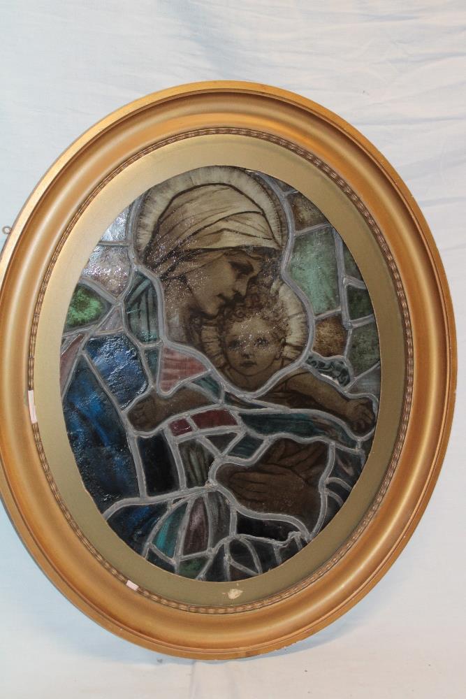 An old leaded stained glass oval window panel,