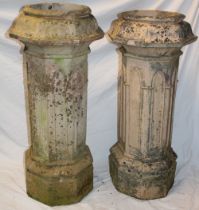 A pair of 18th/19th century traditional chimney pots with Gothic arched decoration on octagonal
