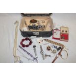 A jewellery box containing a quantity of various costume jewellery including necklaces,