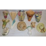 A collection of twelve various pottery wall pockets including Art Deco wall pockets, hat pockets,