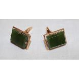 A pair of gentleman's 14ct gold rectangular cuff-links set jade panels