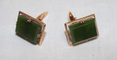 A pair of gentleman's 14ct gold rectangular cuff-links set jade panels