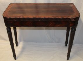 A 19th century rosewood and satinwood rectangular turn-over-top card table on turned tapered legs