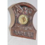 A copper mounted desk clock decorated in relief with Father Time "So Runs the Round of Life from