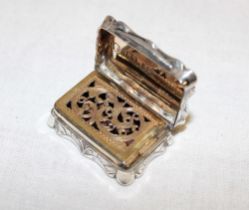 A Victorian silver vinaigrette with hinged internal pierced cover and engraved scroll decoration,