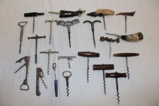 A collection of various corkscrews including turned wood handle corkscrews,