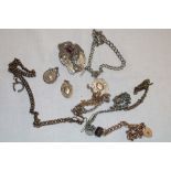 A silver pocket-watch chain, various other pocket-watch chains, silver fobs etc.