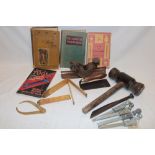 A selection of various old tools including caulking mallet, brass dividers, compass plane,