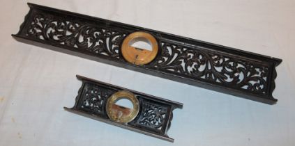 A pair of old brass mounted iron spirit levels by the Davis Level Tool Company with inset brass