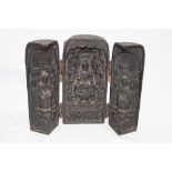 An old Eastern carved wood folding shrine depicting Buddha figures and characters, signed,