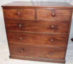 A Victorian mahogany chest of two short and three long drawers with turned handles on plinth base