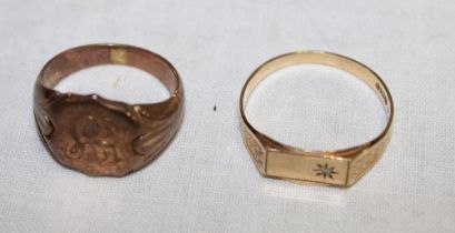A 9ct gold dress ring set a single diamond (2.
