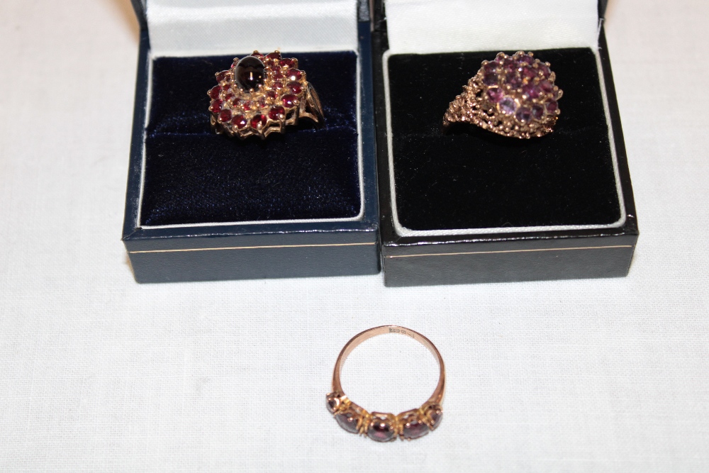 Three various 9ct gold dress rings set garnet (14.